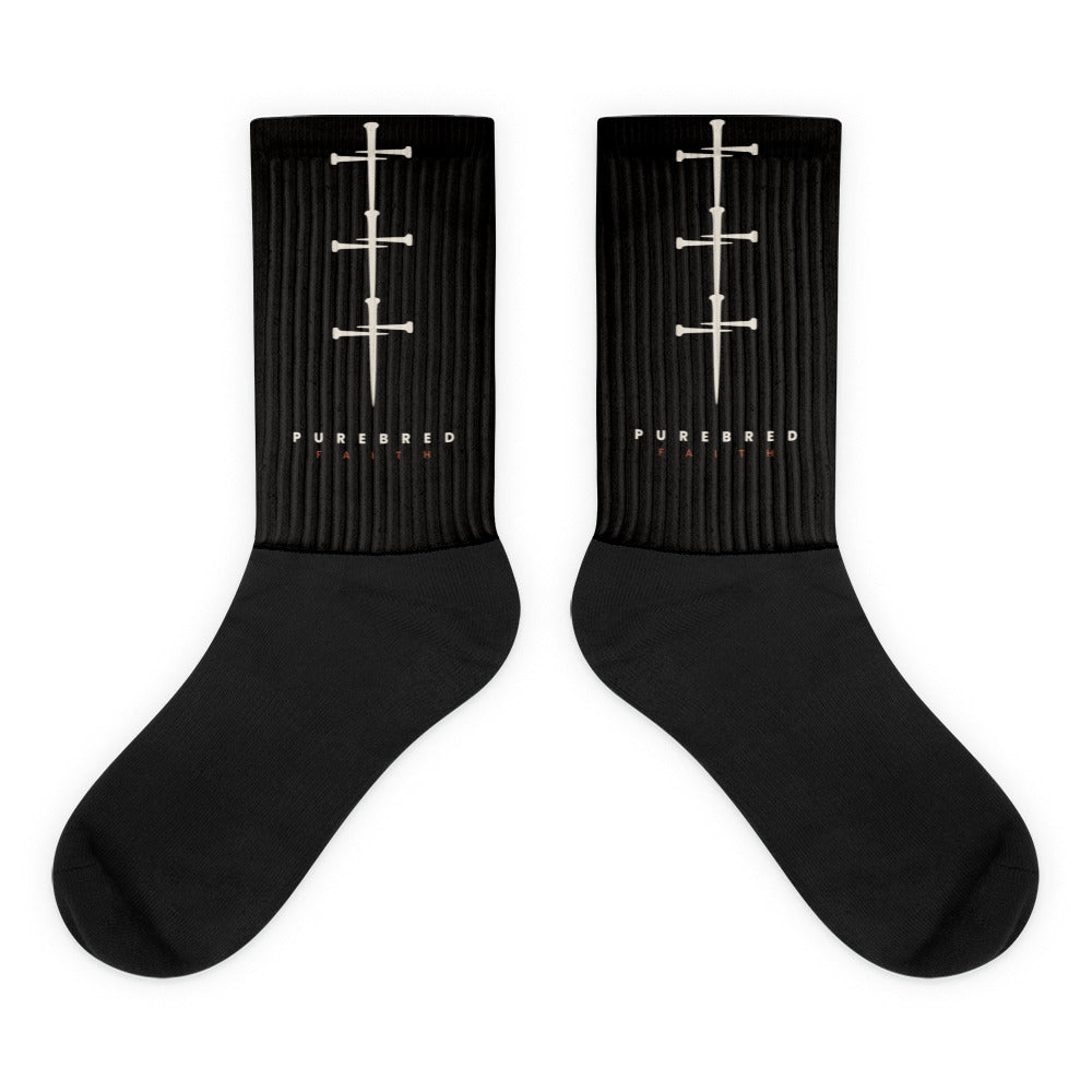 Three Nails Christian socks included in the bundle, black crew socks with cream nail crosses up the leg above the PUREBRED FAITH wordmark