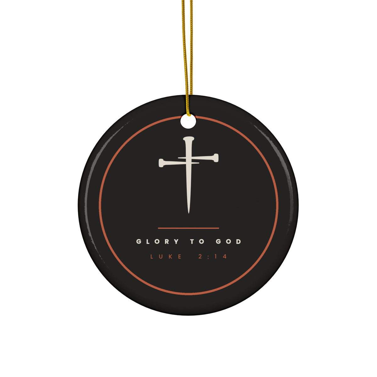 Black ceramic Christmas ornament with cream nail cross and Glory To God, Luke 2:14, inside a copper ring, hanging from a gold string