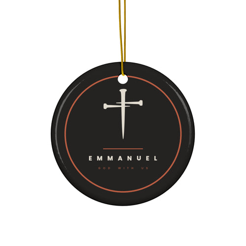 Black ceramic Christmas ornament with cream nail cross and Emmanuel, God With Us, inside a copper ring, hanging from a gold string