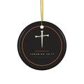 Black ceramic ornament with cream nail cross and Jeremiah 29:11 inside a copper ring, hanging from a gold string