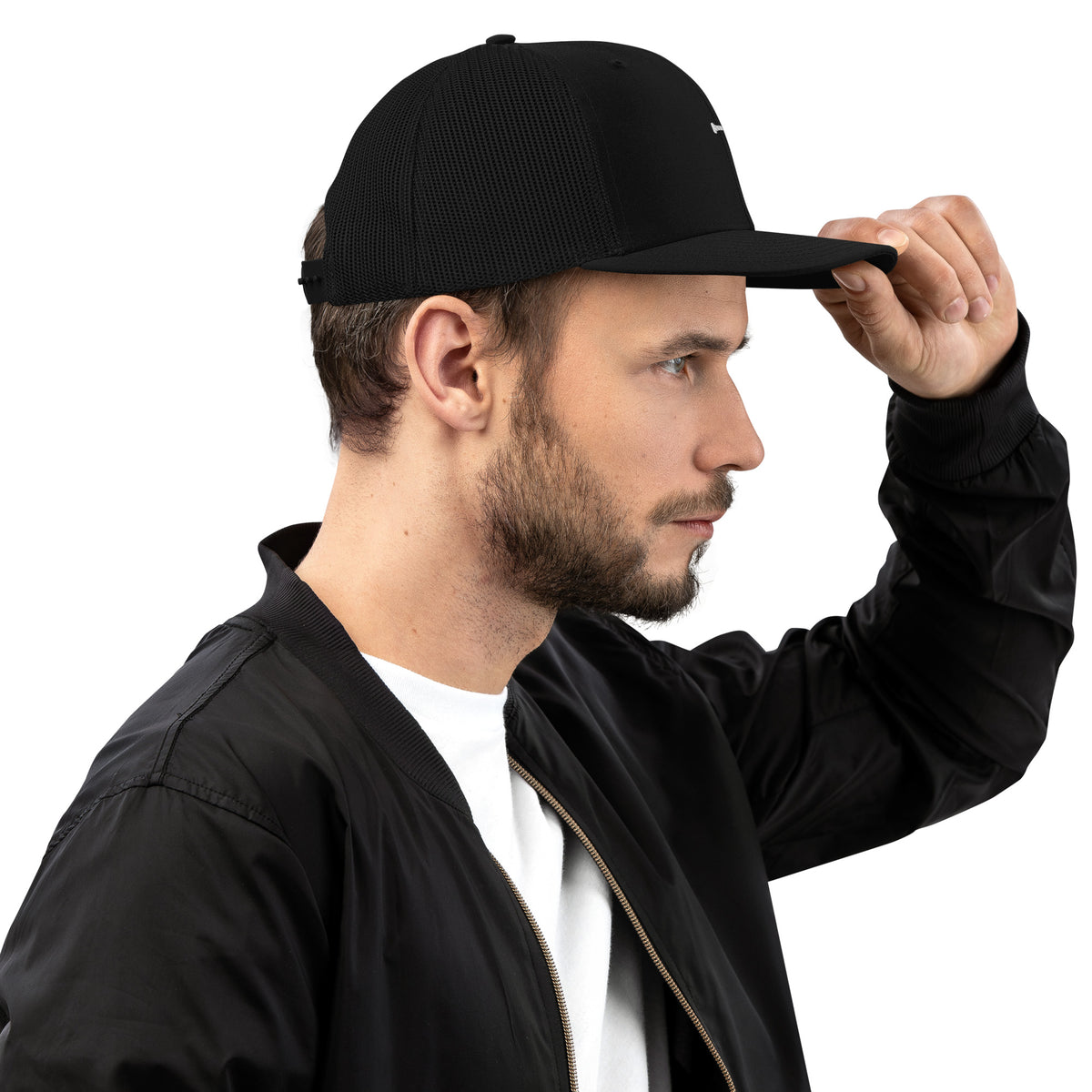 Model adjusting the PureBred Cross trucker cap