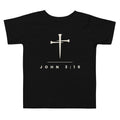 Black toddler t-shirt with a cream three-nail cross and JOHN 3:16 - PureBred Faith