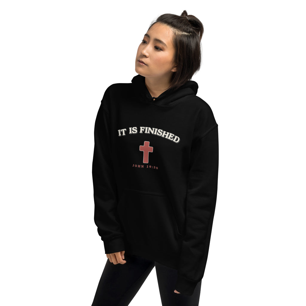 Woman wearing the It Is Finished black hoodie, side view