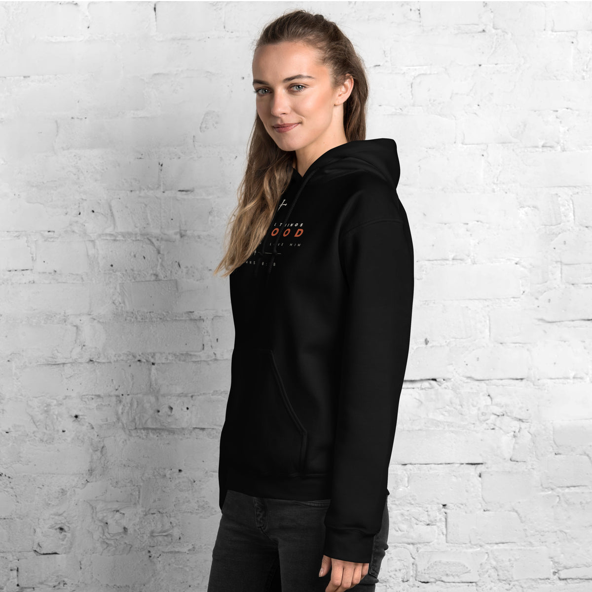 Romans 8:28 black hoodie worn, left front angle