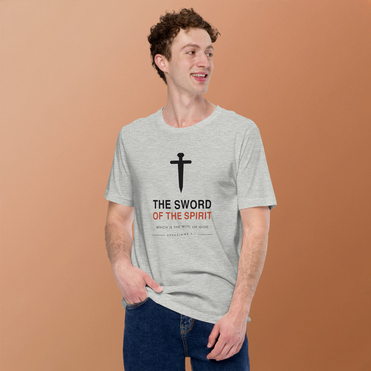 The Sword Of The Spirit T-Shirt — model wearing the athletic heather tee, front view on a warm backdrop