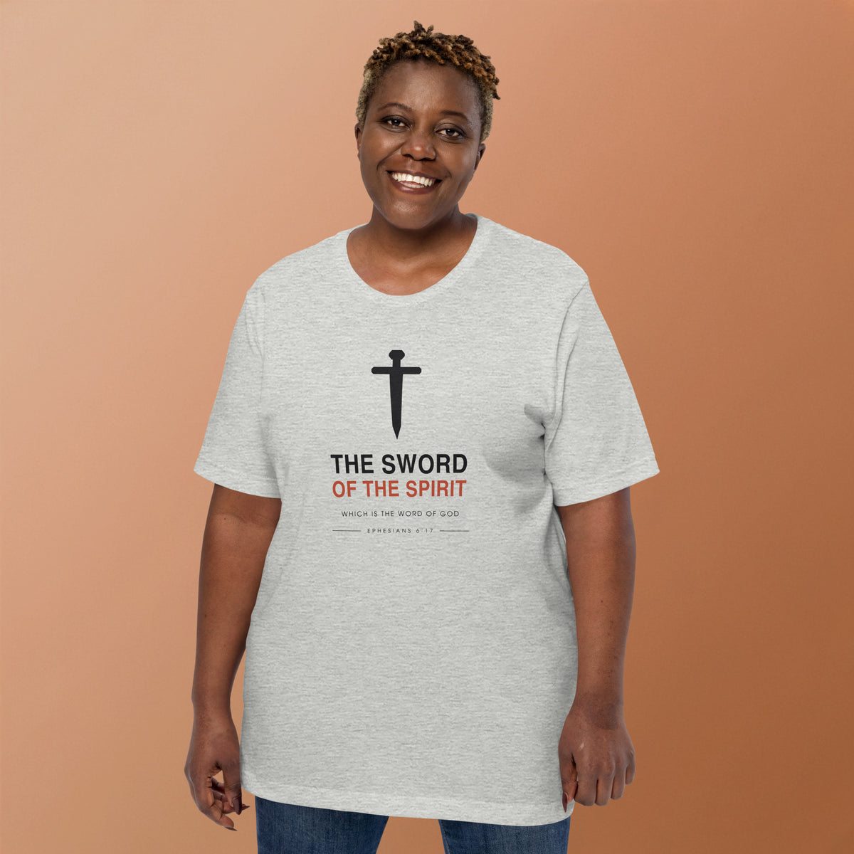 The Sword Of The Spirit T-Shirt — model wearing the athletic heather tee, front view showing the sword and Ephesians 6:17 lettering