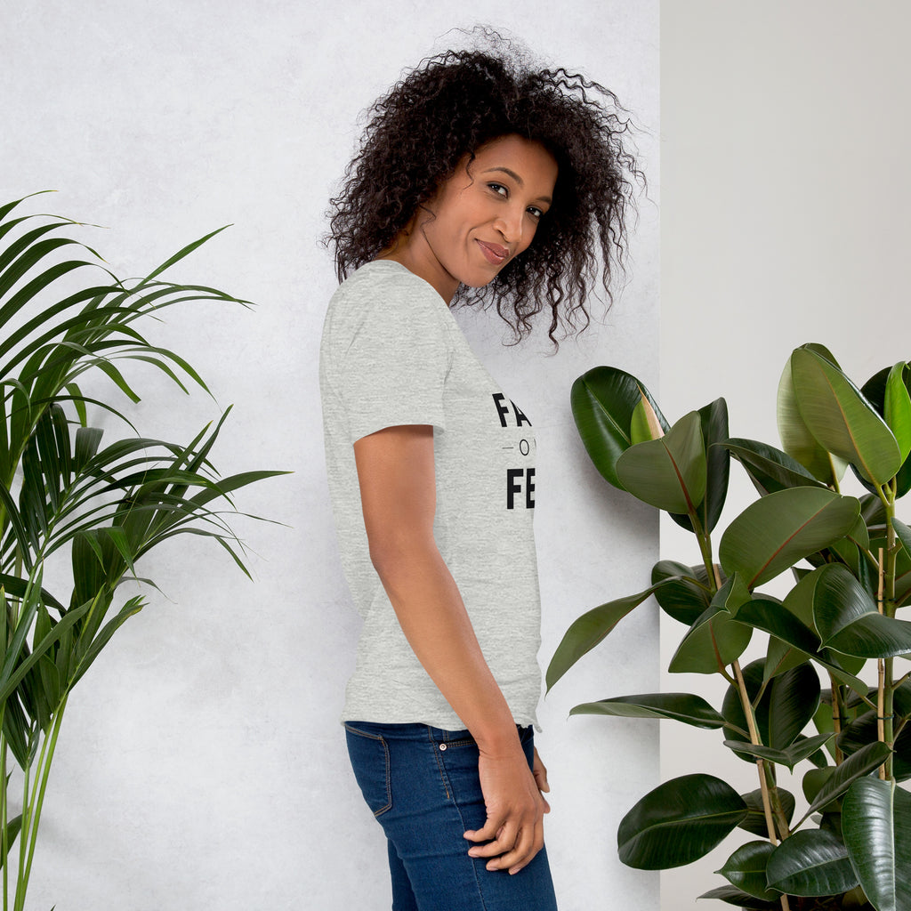 Faith Over Fear T-Shirt — lifestyle photo of the athletic heather tee