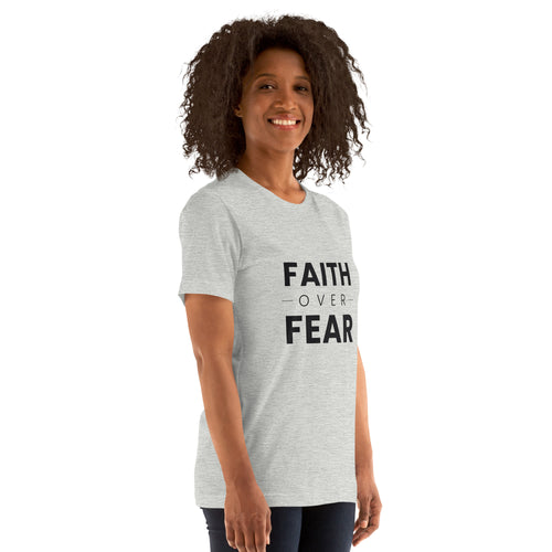 Faith Over Fear T-Shirt — woman wearing the athletic heather tee, three-quarter view
