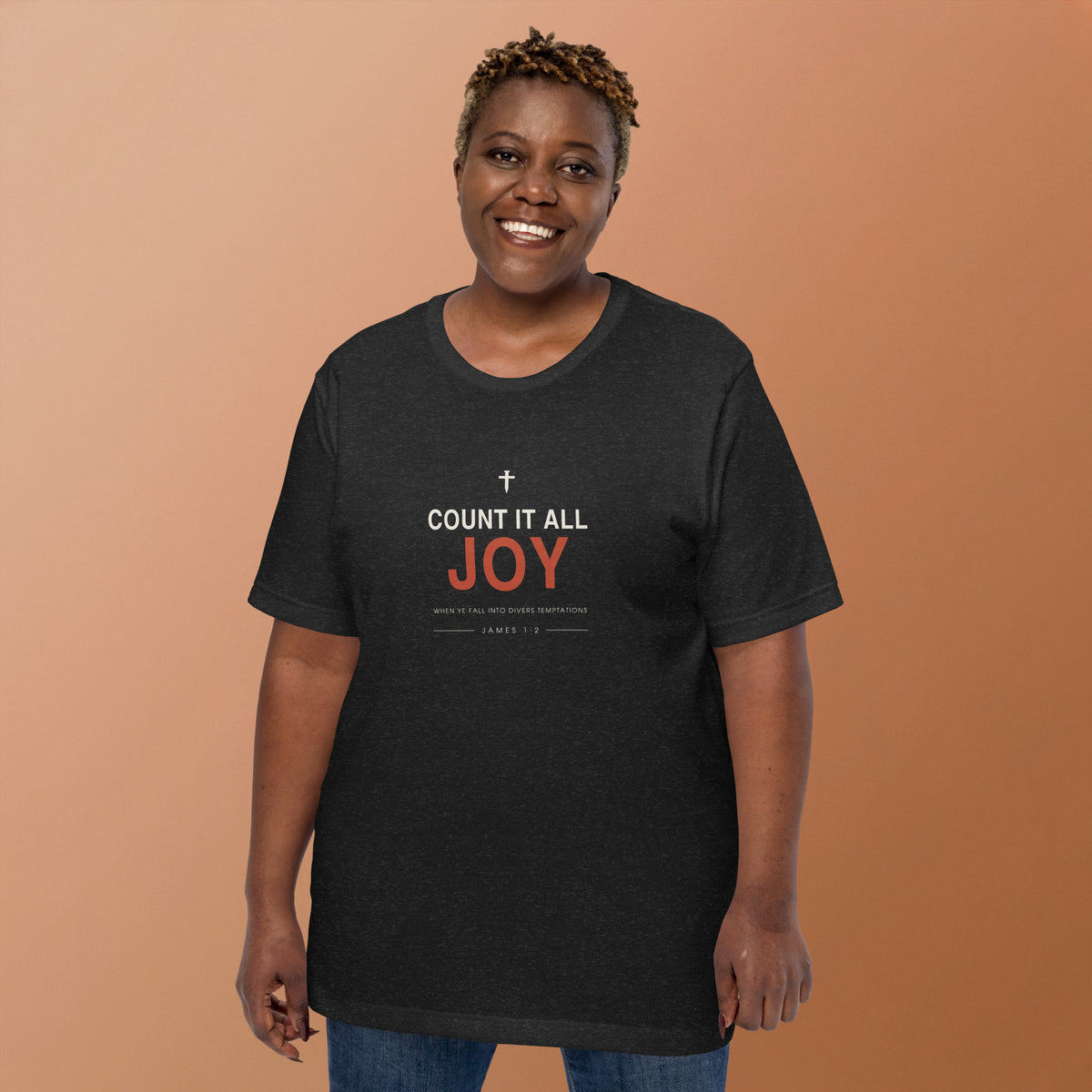 Count It All Joy T-Shirt — model wearing the black heather tee, front view showing the cross and James 1:2 reference