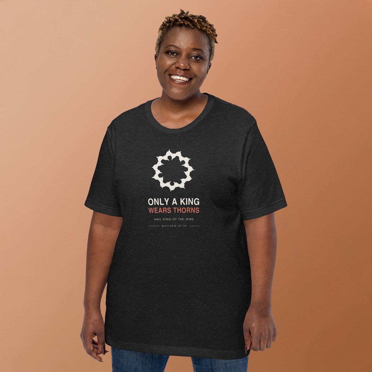 Only A King Wears Thorns T-Shirt — model wearing the black heather tee, front view showing the crown of thorns graphic