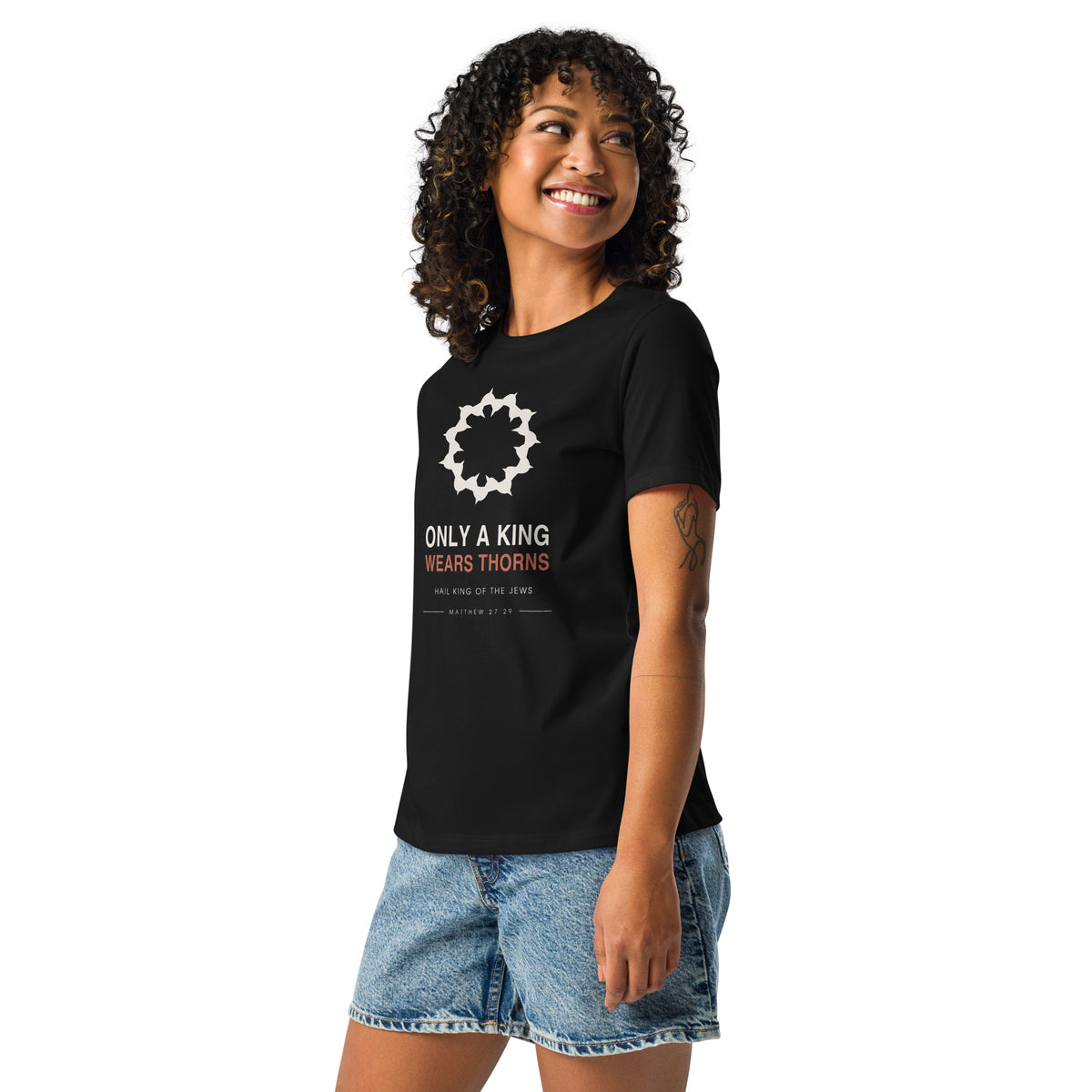 Only A King Wears Thorns Women's Relaxed T-Shirt — model in the black relaxed tee, three-quarter view showing the fit