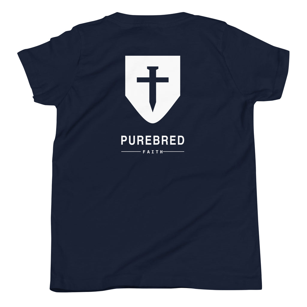Back of the navy kids tee showing the PureBred Faith cross shield and wordmark